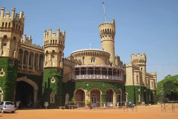 The exterior of Bangalore Palace showing ivy-covered walls and towers